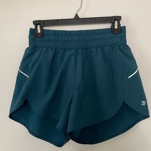 Two pairs of Target athletic shorts (black and teal)
